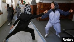 Afghan girls practice their daily training at a fencing club in Kabul on March 4.