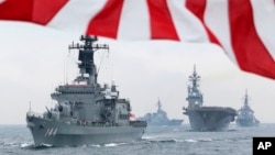 Japan says it will send vessels to protect shipping in the Persian Gulf region but won't join a U.S.-led coalition.