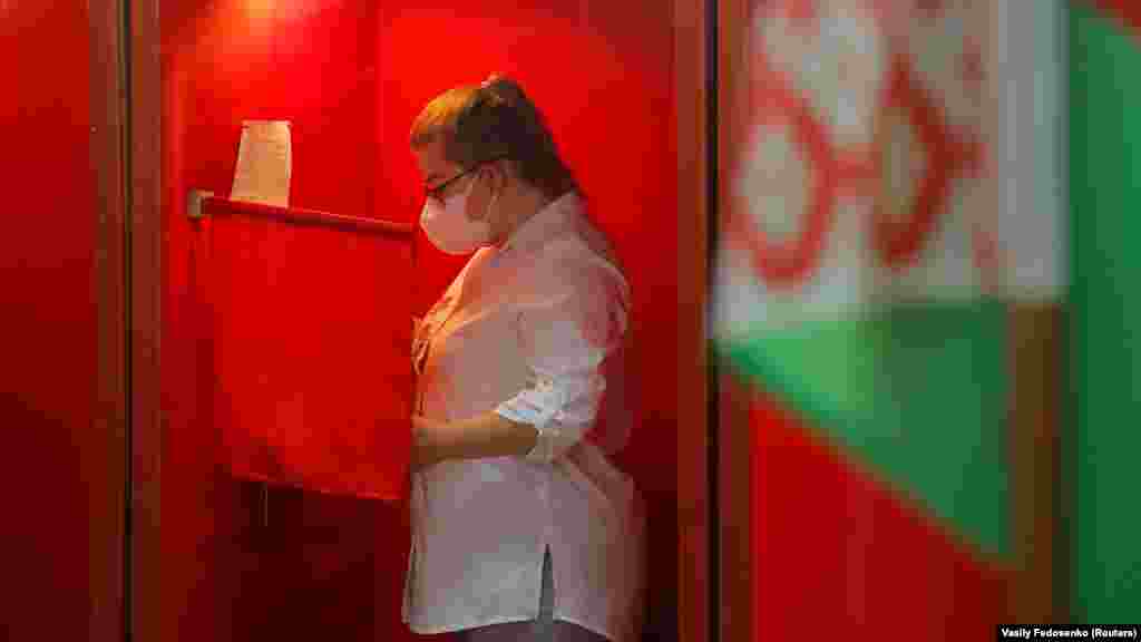 A woman casts her ballot in Minsk.