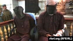 Two of the defendants are seen in court in Kabul on September 7, where the court needed just a few hours to sentence the seven men to death for the attack.