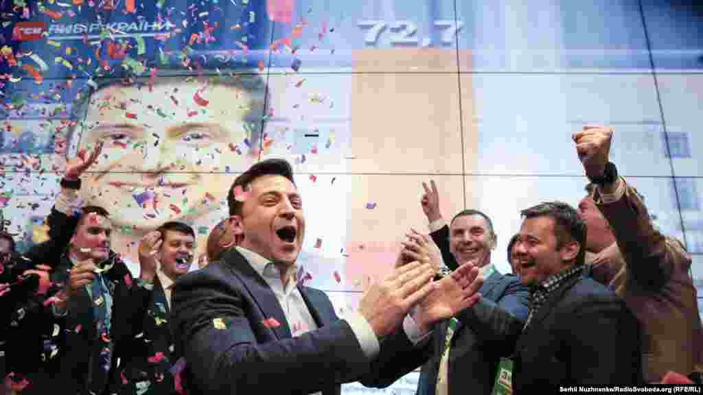 Ukrainian presidential candidate Volodymyr Zelenskiy celebrates in Kyiv after exit polls showed he was on his way to a landslide victory in the April 21 presidential runoff vote. (RFE/RL/Serhii Nuzhnenko)