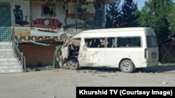 The white minibus was carrying 15 employees of Khurshid TV when the blast hit.