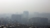 A general view taken from northern Tehran shows a blanket of smog covering the city as heavy pollution hit the Iranian capital on December 15, 2019.