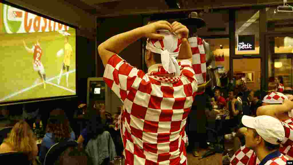 Croatia -- Croatian soccer fans cheer their team as they watch in downtown Zagreb, June 12, 2014