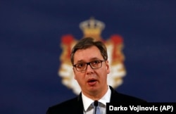 Serbian President Aleksandar Vucic peaks to reporters in Belgrade on January 16.