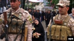 Iraqi soldiers stand guard during the religious ceremony of Ashura in the holy city of Karbala on November 3.