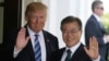 U.S. President Donald Trump (left) made his comments after meeting his South Korean counterpart Moon Jae-in (right) at the White House in Washington on June 30. 