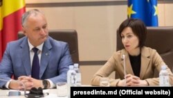 Președintele Igor Dodon, liderul neformal al PSRM, și prim-ministra Maia Sandu, unul dintre fondatorii Blocului ACUM. 12 iulie 2019