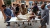 An injured man is taken to a hospital after the bomb blast at the mosque.