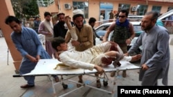 An injured man is taken to a hospital after the bomb blast at the mosque.