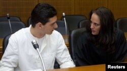 Arid Uka (left) talks with his lawyer Michaela Roth as he arrives for the start of his trial in Frankfurt.