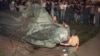 A crowd watches the statue of KGB founder Feliks Dzerzhinsky being toppled on Lubyanka Square in Moscow on August 22, 1991.