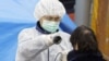 Medical staff check radiation levels of residents of the city of Koriyama in Fukushima Prefecture on March 13.