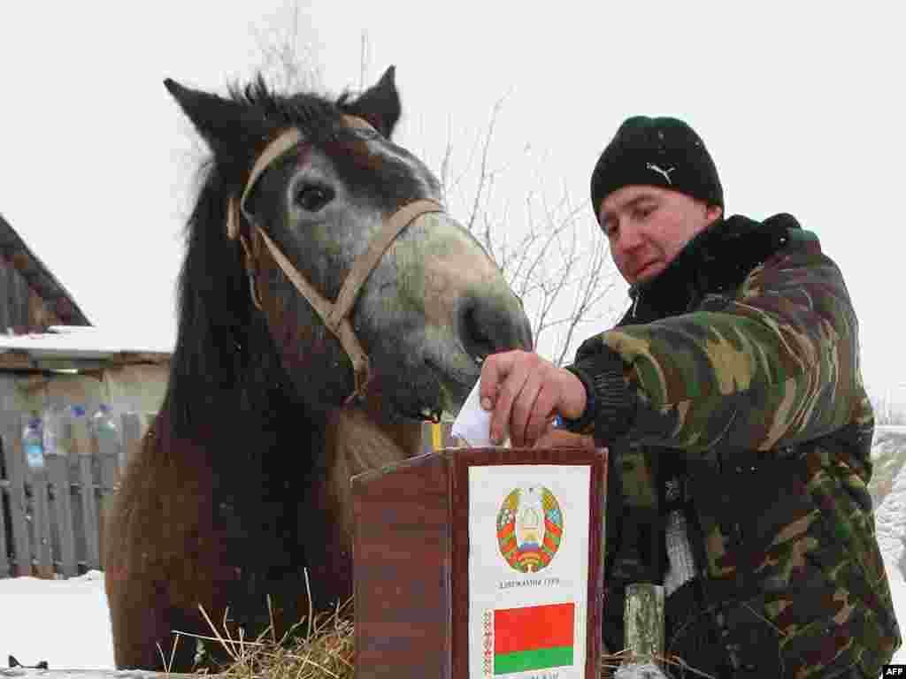 A man casts his ballot during voting in the village of Bogdanovshchyna.