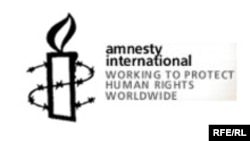 Amnesty International ұйымының белгісі. Көрнекі сурет.