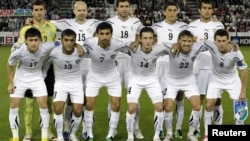 The Uzbek national soccer team poses for a group photograph during the 2011 Asian Cup.