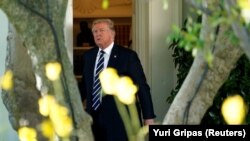 U.S. -- U.S. President Donald Trump walks out from the Oval Office of the White House in Washington, U.S., before his departure to Greer, South Carolina, October 16, 2017