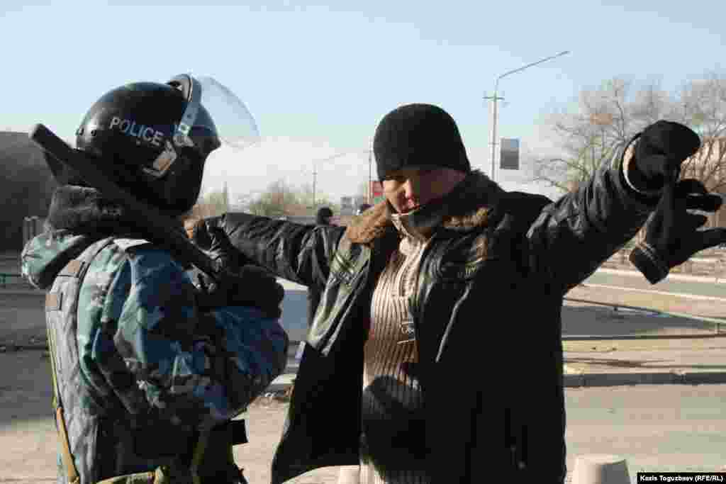 On the streets of Zhanaozen, police officers are carrying out random security checks.