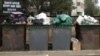 Бизнес в Астане на выносе мусора от дверей квартиры