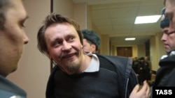 Voina founder Oleg 'Vor' Vorotnikov outside a courtroom on February 21.