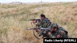 Afghan forces fighting Taliban militants in Kunduz.