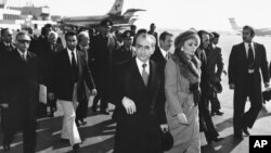 FILE - In this Jan. 16, 1979 file picture, Shah Mohammad Reza Pahlavi and Empress Farah walk on the tarmac at Mehrabad Airport in Tehran to board a plane to leave Iran.