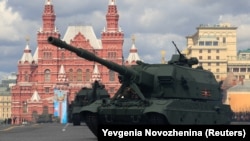 Coalition-SV self-propelled howitzers drive during a rehearsal for a Victory Day parade on Red Square in central Moscow on May 7, 2021.