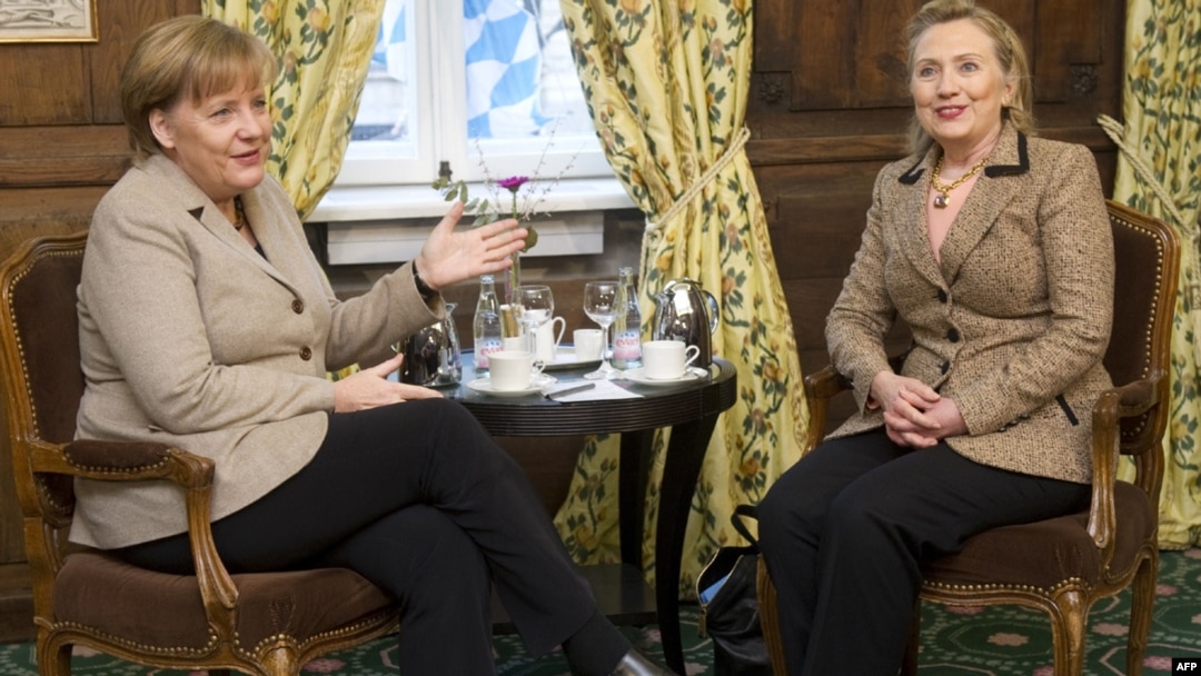 U.S. Secretary of State Hillary Clinton (right) and German Chancellor Angela Merkel confer before a meeting at the Munich Security Conference on February 5.