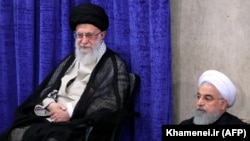 Iranian Supreme Leader Ayatollah Ali Khamenei and President Hassan Rouhani attend a government meeting in the capital Tehran, May 14, 2019