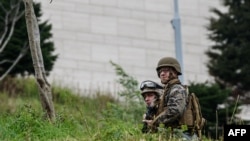 U.S. Marines stand guard outside the Consulate General in Istanbul in December 2015.