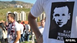 Bosnians attend the funeral of Vedran Puljic, a Sarajevo soccer fan who was killed in clashes with rival fans and police.