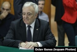 Mugur Isărescu, governor of the National Bank of Romania, goes to the Parliament