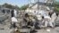 Pakistani security officials inspect the scene of a suicide bomb attack in Quetta on June 23.