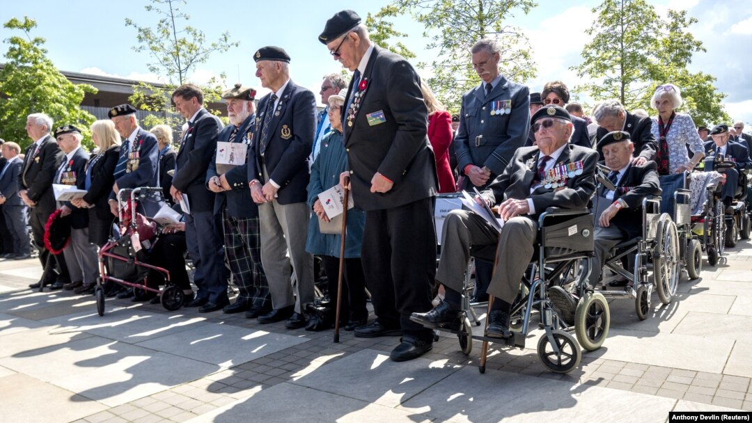 British veterans observe two minutes of silence at an event to commemorate the 75th anniversary of D-Day in Alrewas, Staffordshire, Britain, in 2019.