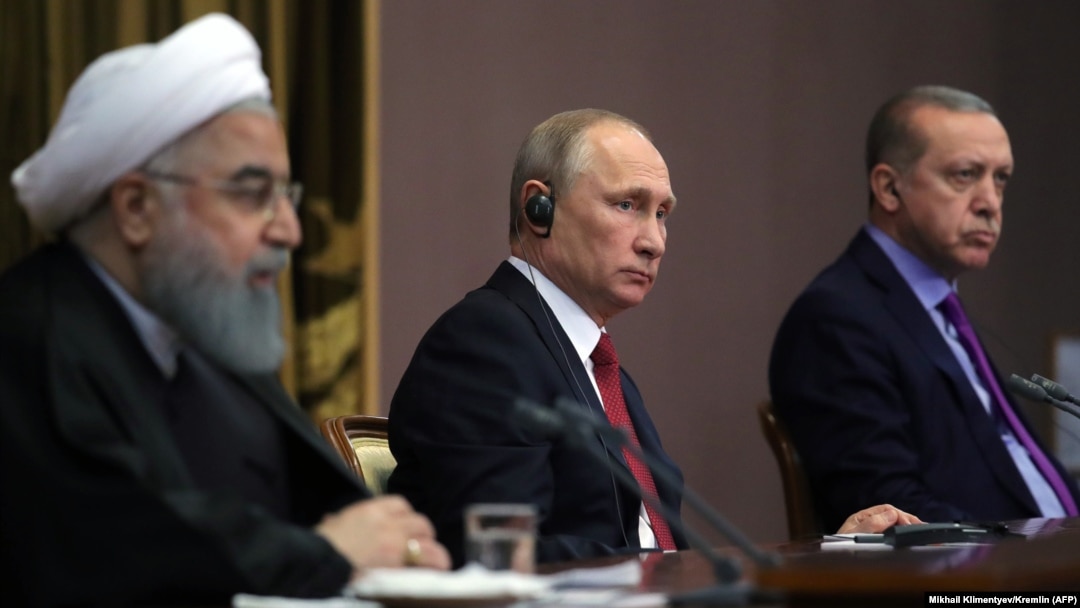 Iranian President Hassan Rohani (left) Russian President Vladimir Putin (center), and Turkish President Recep Tayyip Erdogan address the media after a trilateral meeting on Syria in Sochi, November 22, 2017
