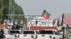 Supporters of former Prime Minister Imran Khan's Pakistan Tehreek-e-Insaf party block a road during a protest in Islamabad on October 5, 2024.