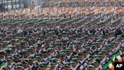 IRGC troops march during a military parade commemorating the anniversary of start of the 1980-88 Iraq-Iran War in front of the shrine of the late revolutionary founder, Ayatollah Khomeini, just outside Tehran.