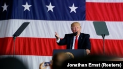 Trump speak at a U.S. naval base in Sicily on May 27.