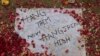 A note is pictured on the ground at the entrance of the Army Public School, which was attacked by Taliban in Peshawar.