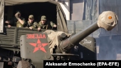 Separatist forces take part in exercises on a shooting range near Luhansk.