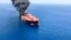 One of the two oil tankers is seen on fire in the sea off Oman on June 13.