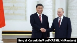 ჩინეთისა და რუსეთის პრეზიდენტების, სი ძინპინისა (მარცხნივ) და ვლადიმირ პუტინის შეხვედრა კრემლში. მოსკოვი, 2023 წ. 21 მარტი.