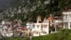 Syria -- A general view shows a church among residential buildings in the Armenian Christian town of Kasab after rebel fighters seized it, March 24, 2014