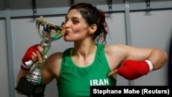 Iranian boxer Sadaf Khadem poses in the locker room after winning the fight against French boxer Anne Chauvin during an official boxing bout in Royan, France, on April 13.