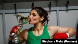 Iranian boxer Sadaf Khadem poses in the locker room after winning the fight against French boxer Anne Chauvin during an official boxing bout in Royan, France, April 13, 2019.