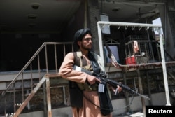 A Taliban fighters stands guard in Kabul.