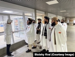 The Taliban delegation being given a tour of a food manufacturing plant in Belarus.