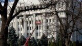 KYRGYZSTAN -- Tazalyk workers clean the Kyrgyz parliament and presidential administration building in Bishkek, November 24, 2020