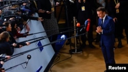 French President Emmanuel Macron attends an EU leaders' summit in Brussels on December 15.
