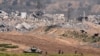 Цей знімок зроблений 6 березня поблизу кордону із Сектором Гази – видно просування ізраїльської техніки та солдат (фото AFP)